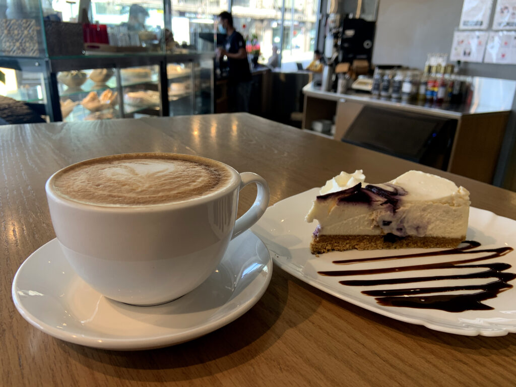 A Latte paired with Tree's famous Cheesecake