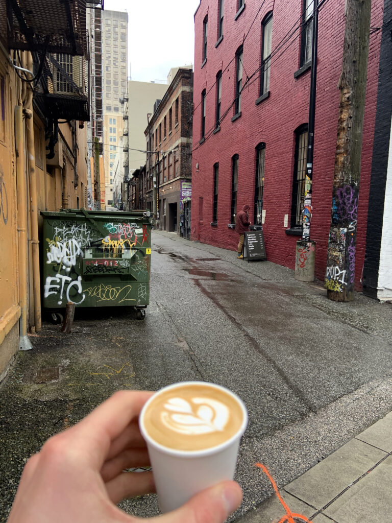 The best Macchiato in Vancouver in front of the alley way, Covid safe, order window in the alley beside Revolver