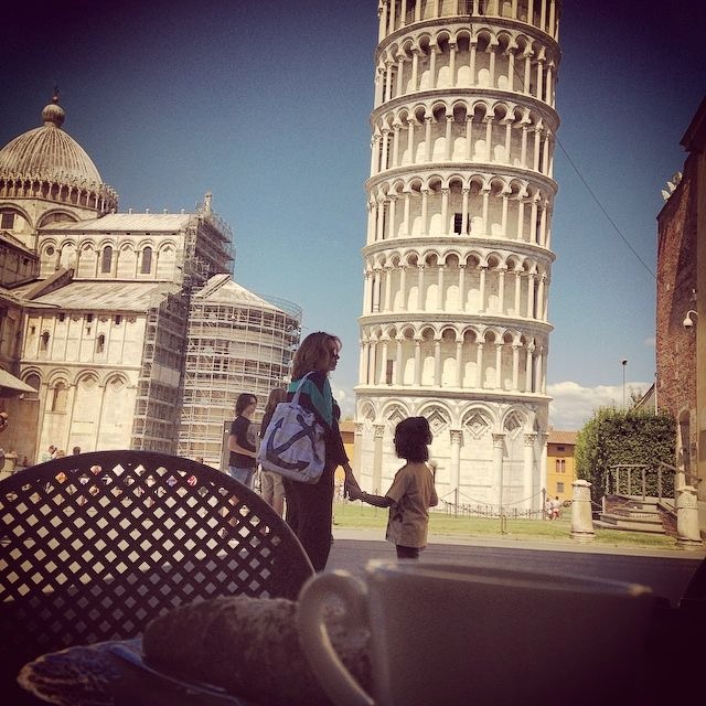 Espresso and a cannoli in front of the leaning tower of Pisa