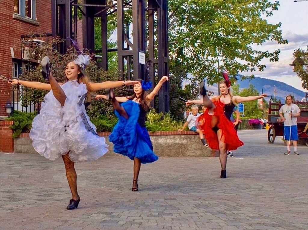 Saloon girls dancing in the plaza